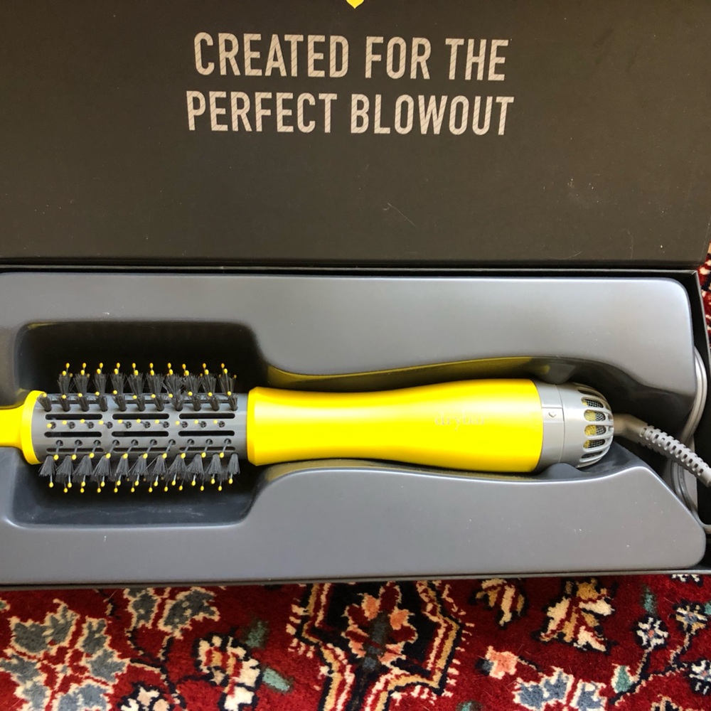 Blow dryer/brush almost new was used 2-3 times only
